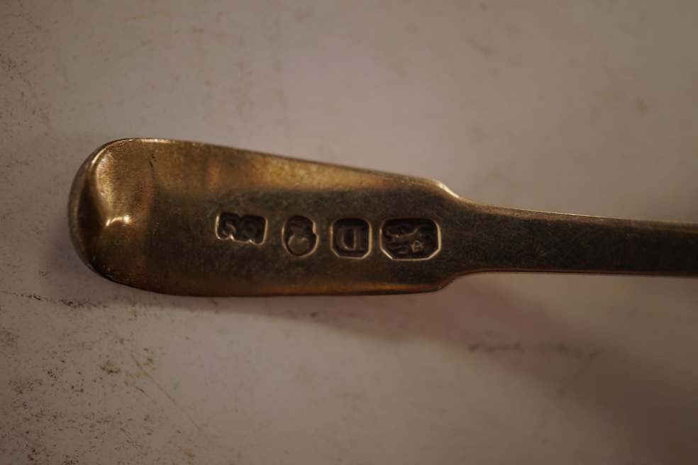 A small collection of nine assorted Georgian and later small silver or white metal spoons, including mustard ladles and other condiment spoons, a caddy spoon, London, 1799, together with a 19th century Russian 84 zolotni